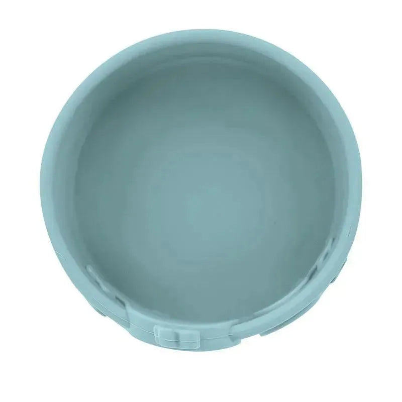 Silicone whale-shaped feeding bowl in soft blue with smooth inner surface and rim for easy handling.