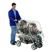 Nuby Tandem Stroller Weather Shield, a clear plastic cover protecting two children in a stroller, held by a man.