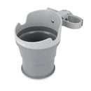 Nuby Universal Collapsible Cup Holder in gray with a clamp for attachment to strollers or other surfaces.