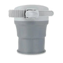 Universal collapsible cup holder in gray, featuring an adjustable strap for secure attachment.