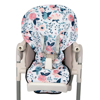 Nuby floral print water-resistant high chair cover with a pastel color scheme and adjustable straps on a high chair.