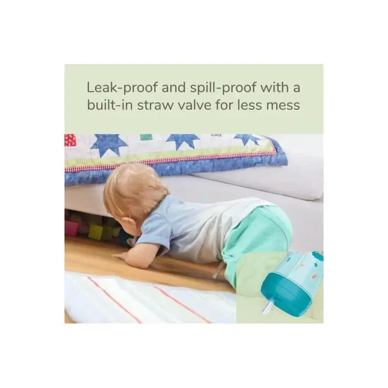 Teal NUK EasyStraw Cup with a built-in straw valve, shown beside a child crawling on the floor.
