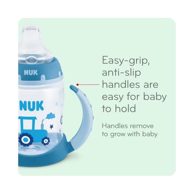 Nuk 5 oz learner cup featuring easy-grip, anti-slip handles and a tractor design, ideal for babies.