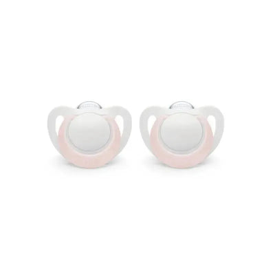 Two pink and white Nuk newborn pacifiers designed for girls, suitable for ages 0-2 months.