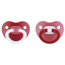 Two assorted red Nuk pacifiers, featuring round shapes and white handles, designed for infants.