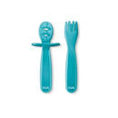 Two-piece set of Nuk toddler utensils: a spoon with a rounded end and a fork with three prongs, both in turquoise.