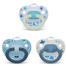 Assorted Nuk pacifiers in blue tones, featuring star and pattern designs, ideal for soothing infants.