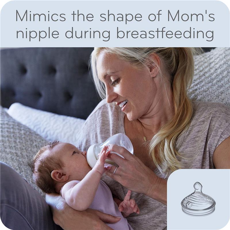 Mom feeding a baby with a Nuk 9 oz Simply Natural baby bottle, featuring a nipple designed to mimic natural breastfeeding.