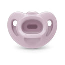 Nuk pacifier in soft pink color, size 1, designed for girls, featuring a comfortable shape and ventilation holes.