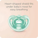 Heart-shaped pacifier designed for easy breathing, featuring a clear mint green shield and a round nipple.