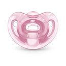 Three pink NUK pacifiers in size 1, designed for girls, featuring a comfortable shape and ventilation holes.