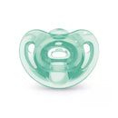 Nuk pacifier in mint green, designed for girls, featuring a comfortable rounded shape and ventilation holes.