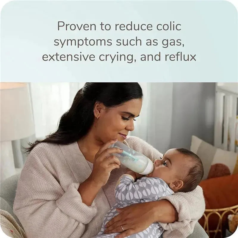 Nuk Smooth Flow Pro Anti-Colic Baby Bottle held by a woman feeding a baby, with text about reducing colic symptoms.