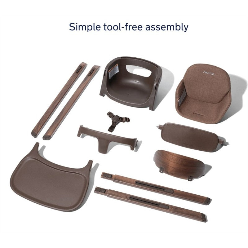 Nuna BRYN High Chair components arranged on a white background, highlighting assembly parts including the seat, tray, and wooden legs.