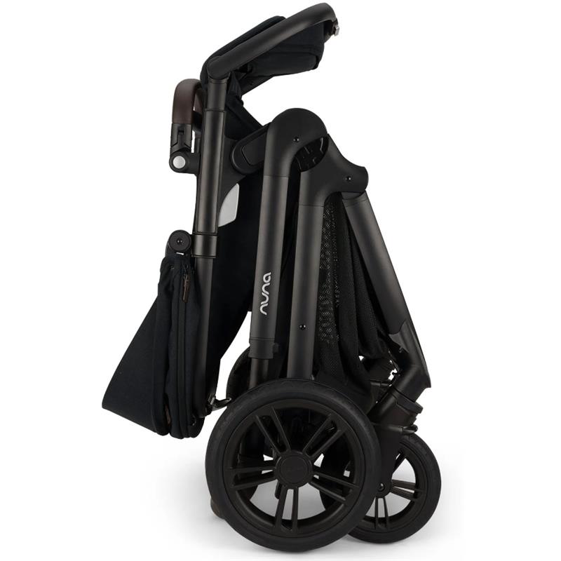 Nuna DEMI™ icon stroller in Caviar color, shown in a folded position, highlighting its sleek design and compact storage.