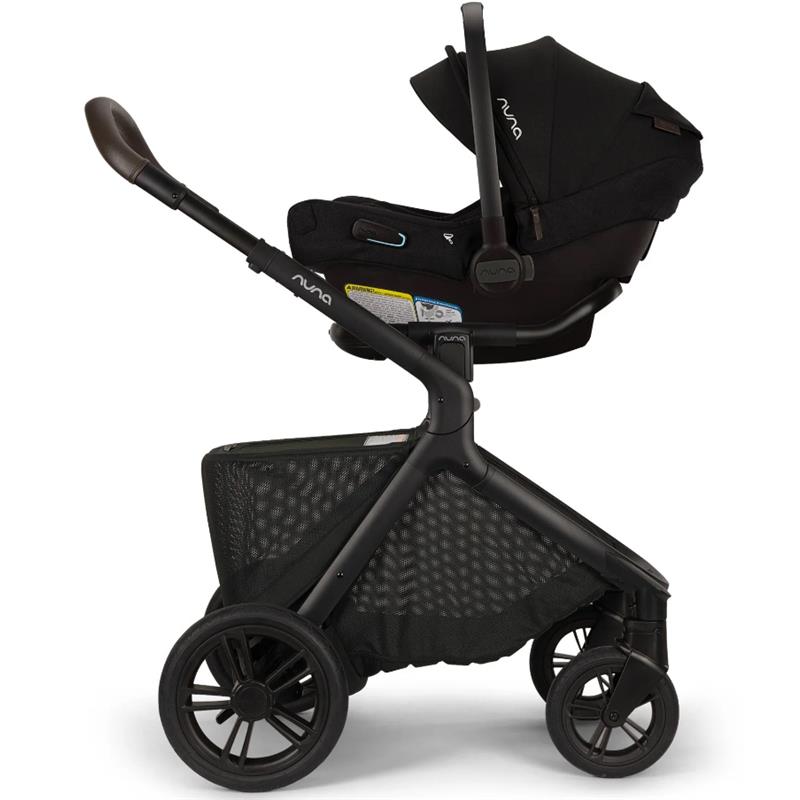 Nuna DEMI™ icon Stroller in Caviar, showcasing a sleek black design with a car seat attached and a mesh storage basket below.