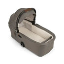 Nuna DEMI™ next Bassinet in Hazelwood color, featuring a soft interior and a lightweight design for easy portability.