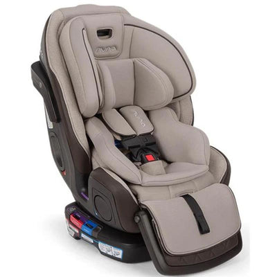 Nuna EXEC™ next All-in-One Car Seat in Biscotti color, featuring plush padding and safety harness for child protection.