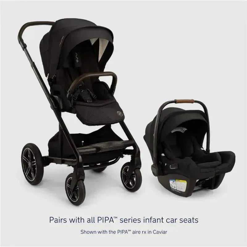 Nuna MIXX™ next Stroller in black with Magnetic Buckle, shown alongside PIPA™ infant car seat in Caviar.