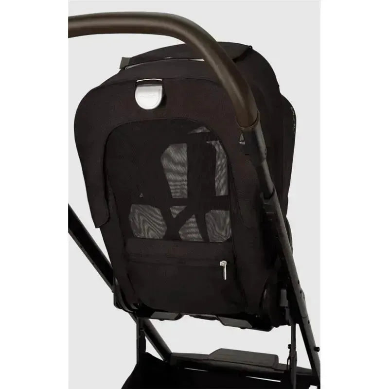 Nuna MIXX™ next Stroller featuring a black mesh seat and a magnetic buckle on the backrest.