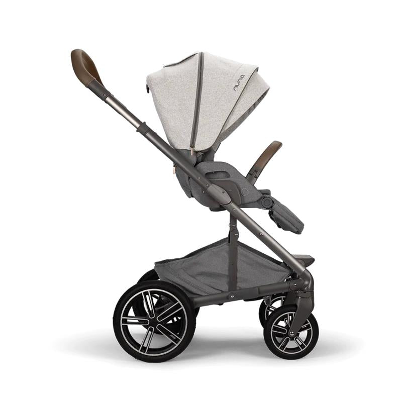 Nuna MIXX™ next Stroller in gray with a large canopy, adjustable seat, and sleek black wheels. Ideal for comfortable travel with children.