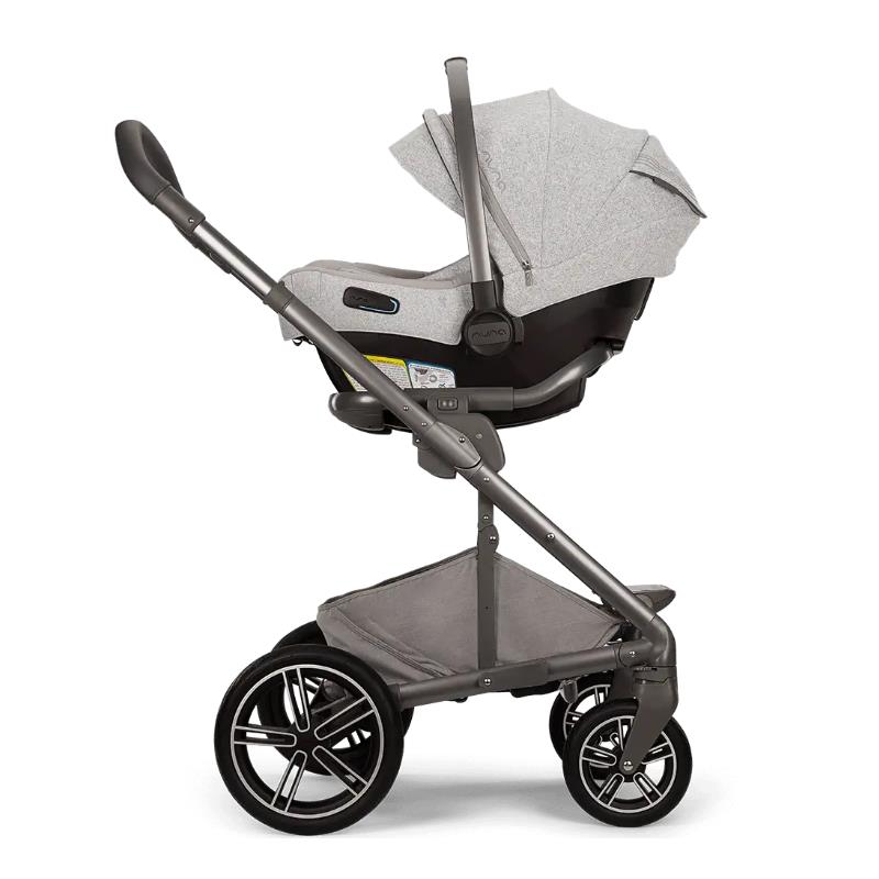 Nuna MIXX™ next stroller in Sterling with a grey infant seat, featuring a sleek frame and large wheels.
