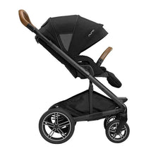 Nuna MIXX™ next stroller in caviar color, featuring a magnetic buckle, adjustable canopy, and brown handle.