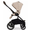 Nuna MIXX™ next stroller in Biscotti color, featuring a foldable design, adjustable canopy, and a spacious under-seat storage.