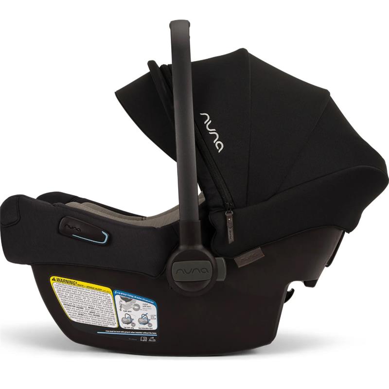 Nuna PIPA™ aire infant car seat in Caviar with a protective canopy and instruction label on the base.