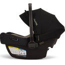 Nuna PIPA™ aire infant car seat in Caviar with a protective canopy and instruction label on the base.