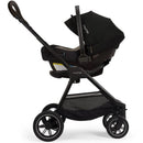 Nuna PIPA™ aire Infant Car Seat attached to a PIPA™ Series Base in caviar color, featuring a sleek design and sunshade.