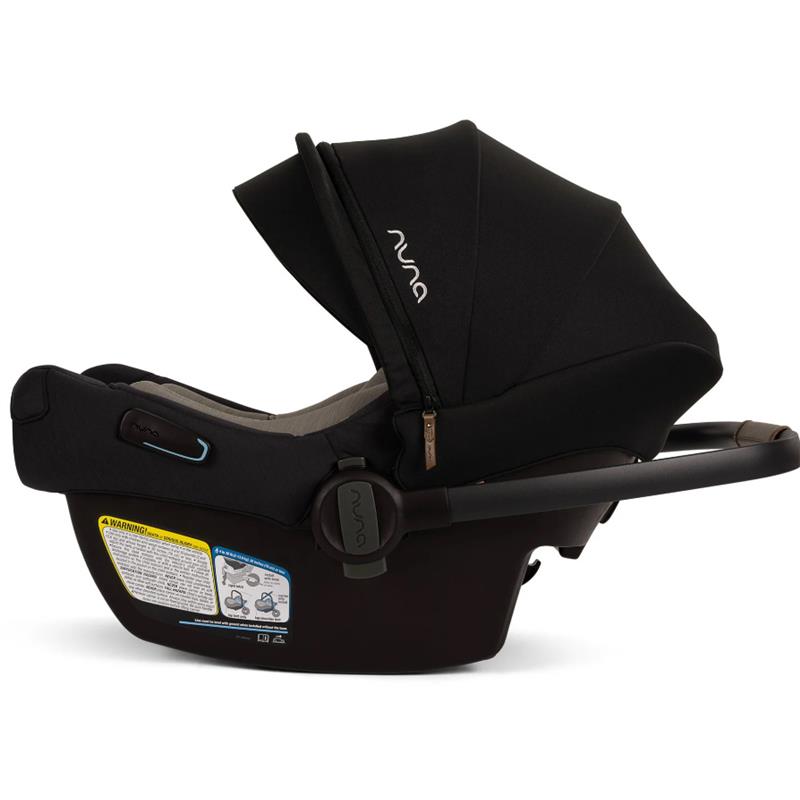 Nuna PIPA™ aire Infant Car Seat in Caviar color, featuring a removable canopy, cushioned seating, and safety labels.