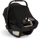 Nuna PIPA™ aire Infant Car Seat in Caviar color with adjustable canopy and safety instructions visible on the base.