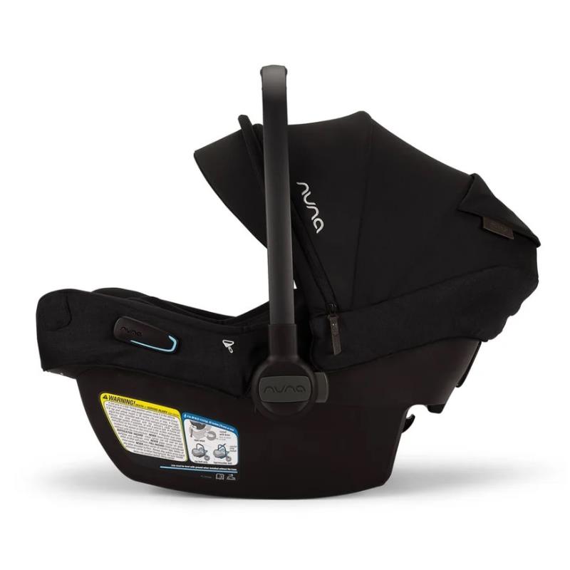 Nuna Pipa Aire Rx Infant Car Seat in Caviar/Chocolate, featuring an adjustable canopy and safety labels on the side.