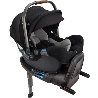 Nuna PIPA™ rx infant car seat with RELX base features a black canopy, grey inserts, and a sturdy base, designed for safety and comfort.