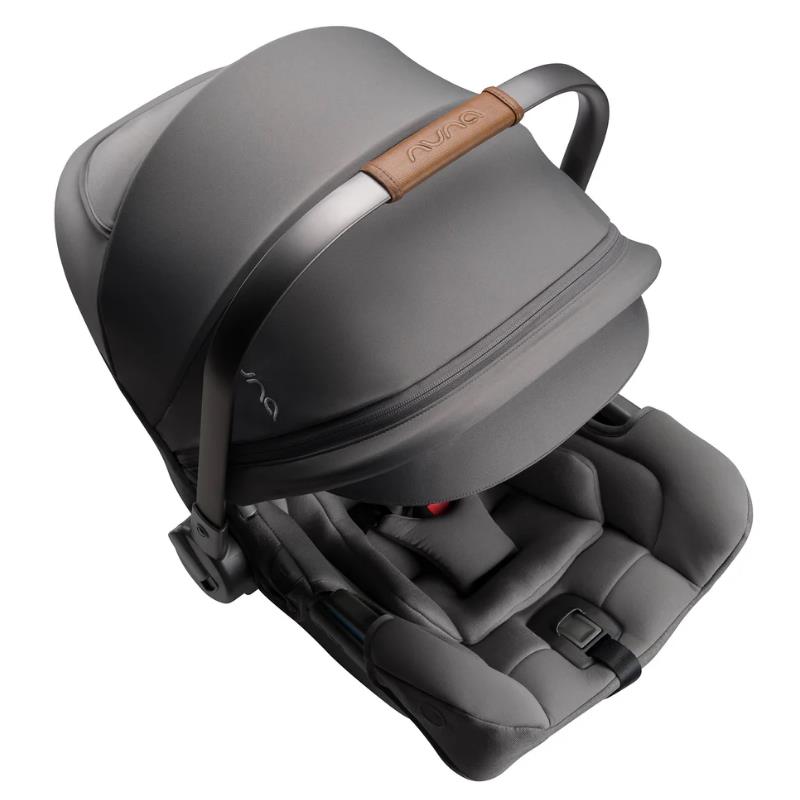 Nuna PIPA rx infant car seat in granite color with a removable canopy and plush interior, designed for safety and comfort.