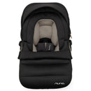 Nuna PIPA™ Series Winter Footmuff in Caviar, featuring a sleek black exterior and cozy quilted interior, designed for infant comfort.