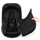 Nuna PIPA™ Series Winter Footmuff in Caviar color, opened, showcasing plush black fabric with zippers and quilted design.