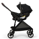Nuna PIPA™ urbn Flex System™ in Caviar color, featuring a car seat secured in a black stroller with a canopy.