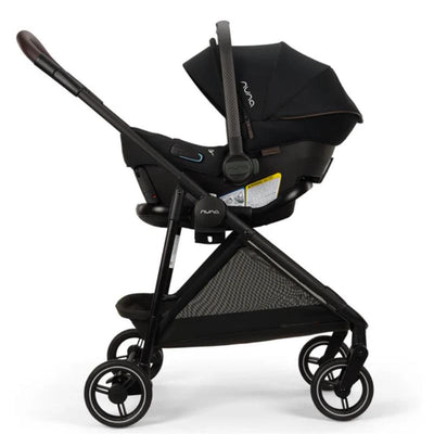 Nuna PIPA™ urbn Flex System™ in Caviar color, featuring a car seat secured in a black stroller with a canopy.