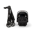 Nuna PIPA urbn Flex System in Caviar color, featuring a sleek infant car seat and compact folded stroller.