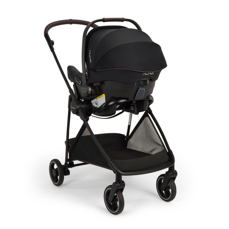 Nuna PIPA urbn Flex System in Caviar color, featuring a car seat and stroller combination with a sleek design.