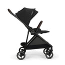 Nuna PIPA™ urbn Flex System™ stroller in Caviar color, featuring a black frame, adjustable canopy, and padded seat.