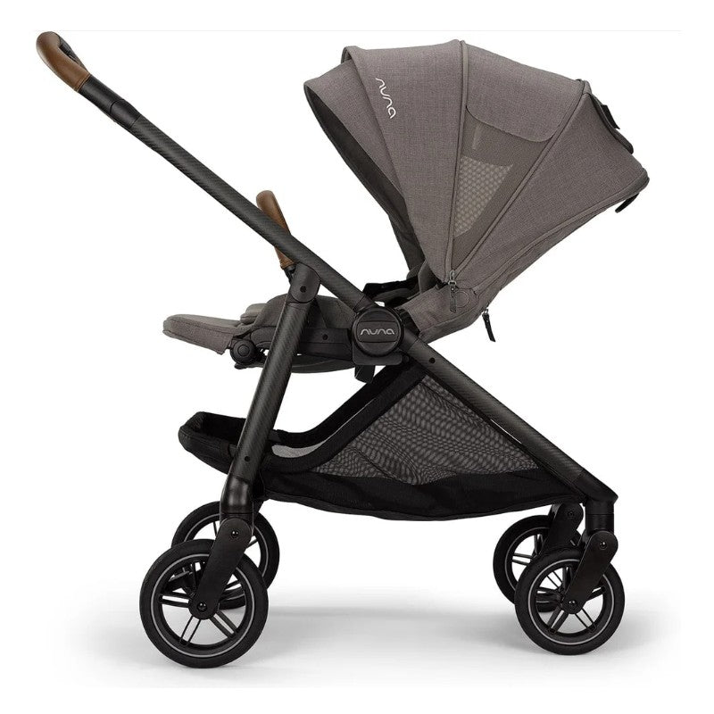 Travel system featuring the Nuna Swiv stroller in granite color with a reclining seat and adjustable canopy.