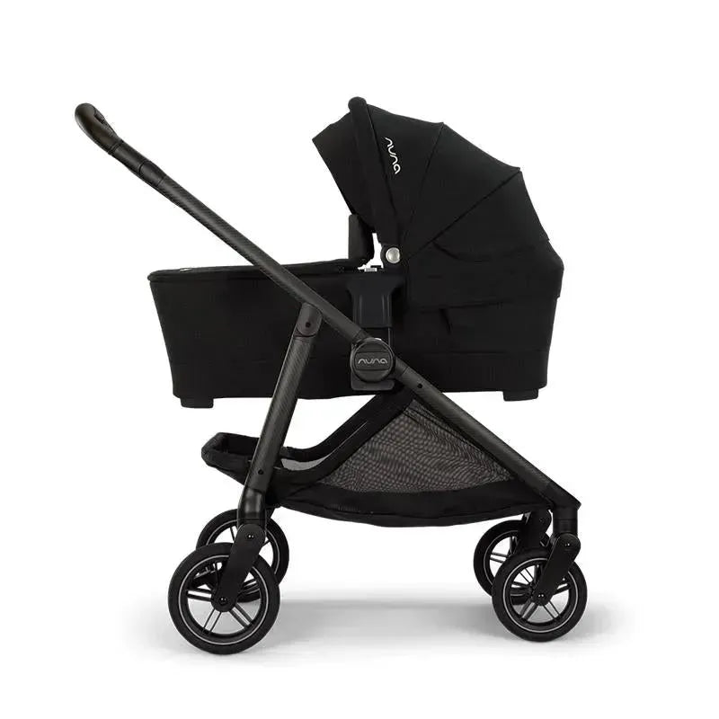 Nuna SWIV™ stroller in Acorn color, featuring a sleek design with a canopy and storage basket.