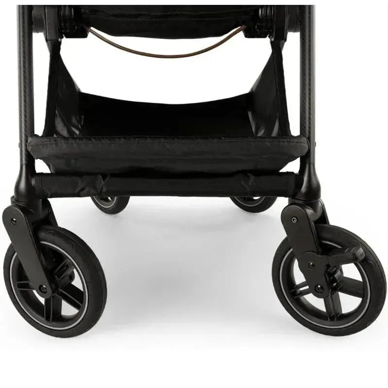 Nuna SWIV™ Stroller in Biscotti color, showcasing the front wheels and lower storage area.