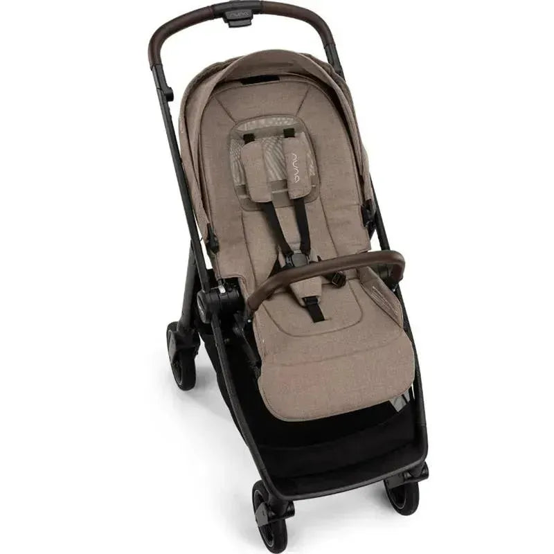 Nuna SWIV™ Stroller in Cedar color features a cushioned seat, adjustable harness, and a sleek black frame.