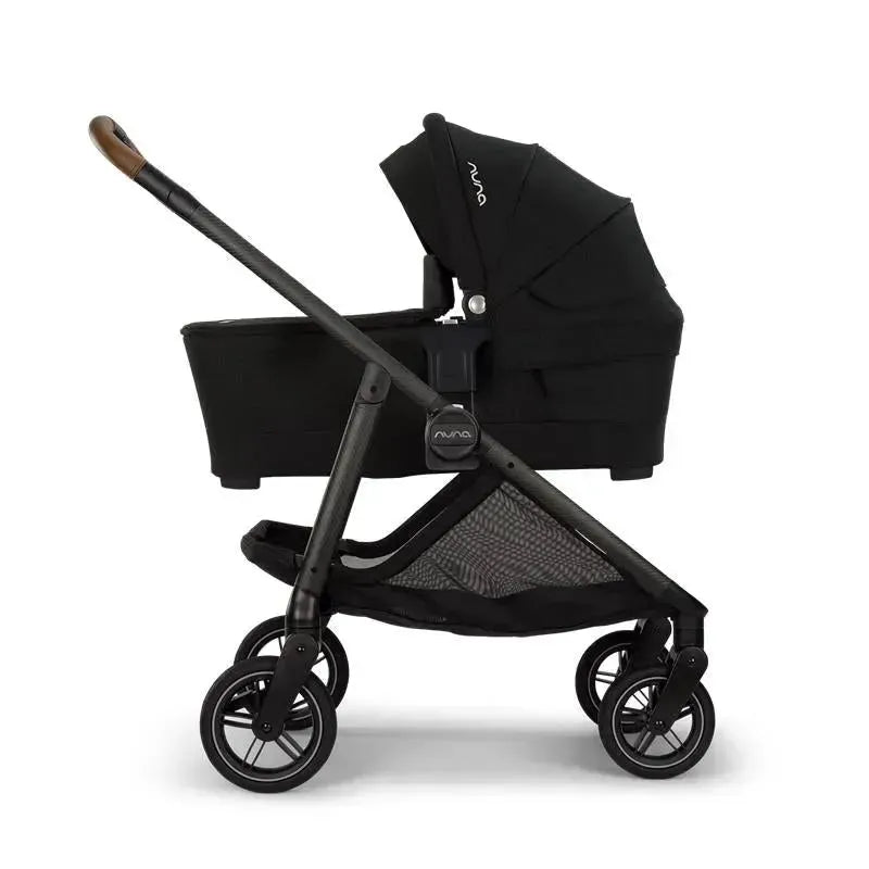 Nuna SWIV™ Stroller in Granite color, featuring a sleek design, adjustable canopy, and large wheels for maneuverability.
