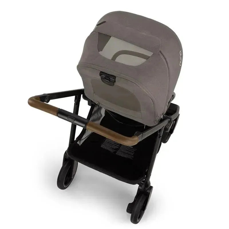 Nuna SWIV™ Stroller in Granite color, featuring a sleek design with a padded seat and brown handle.