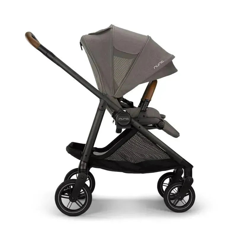 Nuna SWIV™ stroller in Granite color, featuring a canopy, adjustable seat, and multi-directional wheels.